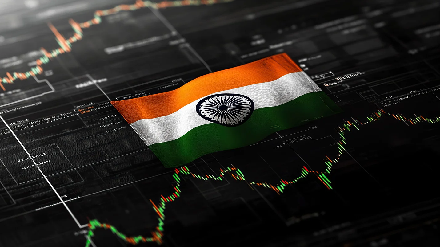 Indian national flag overlaid on financial charts, symbolising India’s economic growth amid global slowdowns.