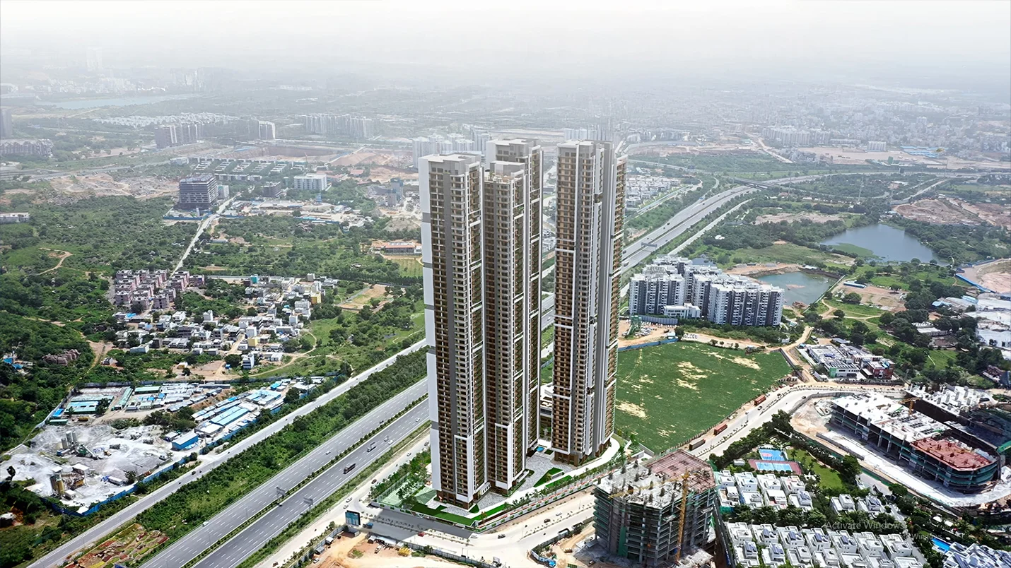 Aerial view of luxury high-rise residential towers surrounded by greenery and city infrastructure.